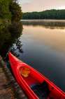 USA, New York. Adirondack Park, Saranac Lake, Hoel Pond, canoe at boathouse dock. Art Print